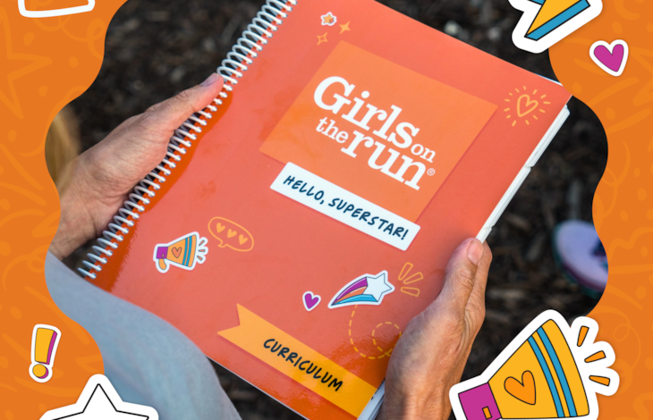 Decorative orange image with photo in the center. A pair of hands holds a copy of the "Hello, Superstar!" Girls on the Run curriculum.